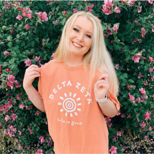 Delta Zeta member wearing Life is Good t-shirt with image of the sun